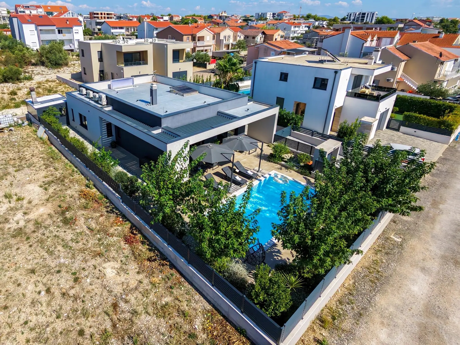 Aerial view framing the full villa and grounds